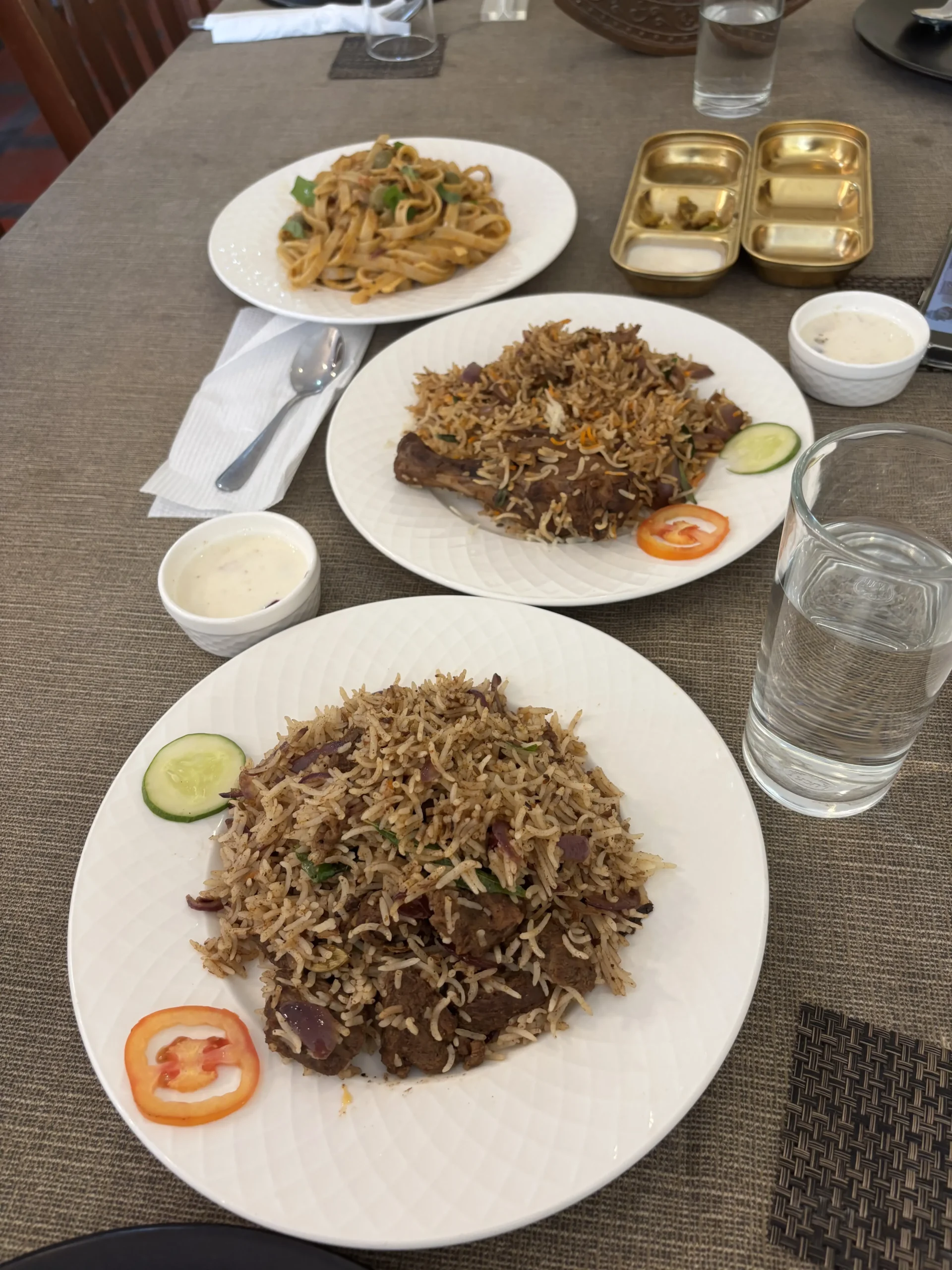 Rice dishes and pasta on a dining table at Theiven Café