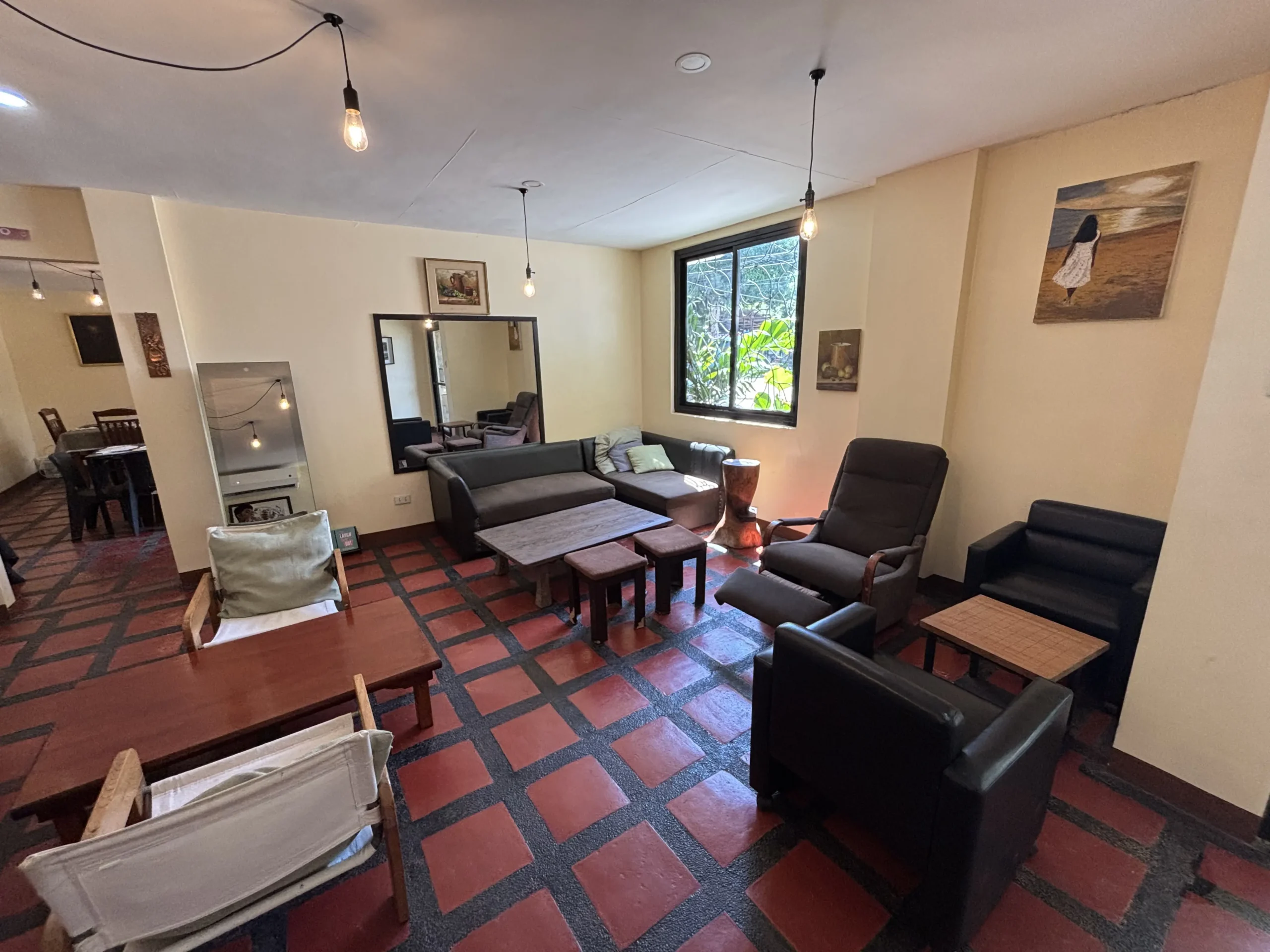 Indoor lounge chairs and tables at Theiven Café