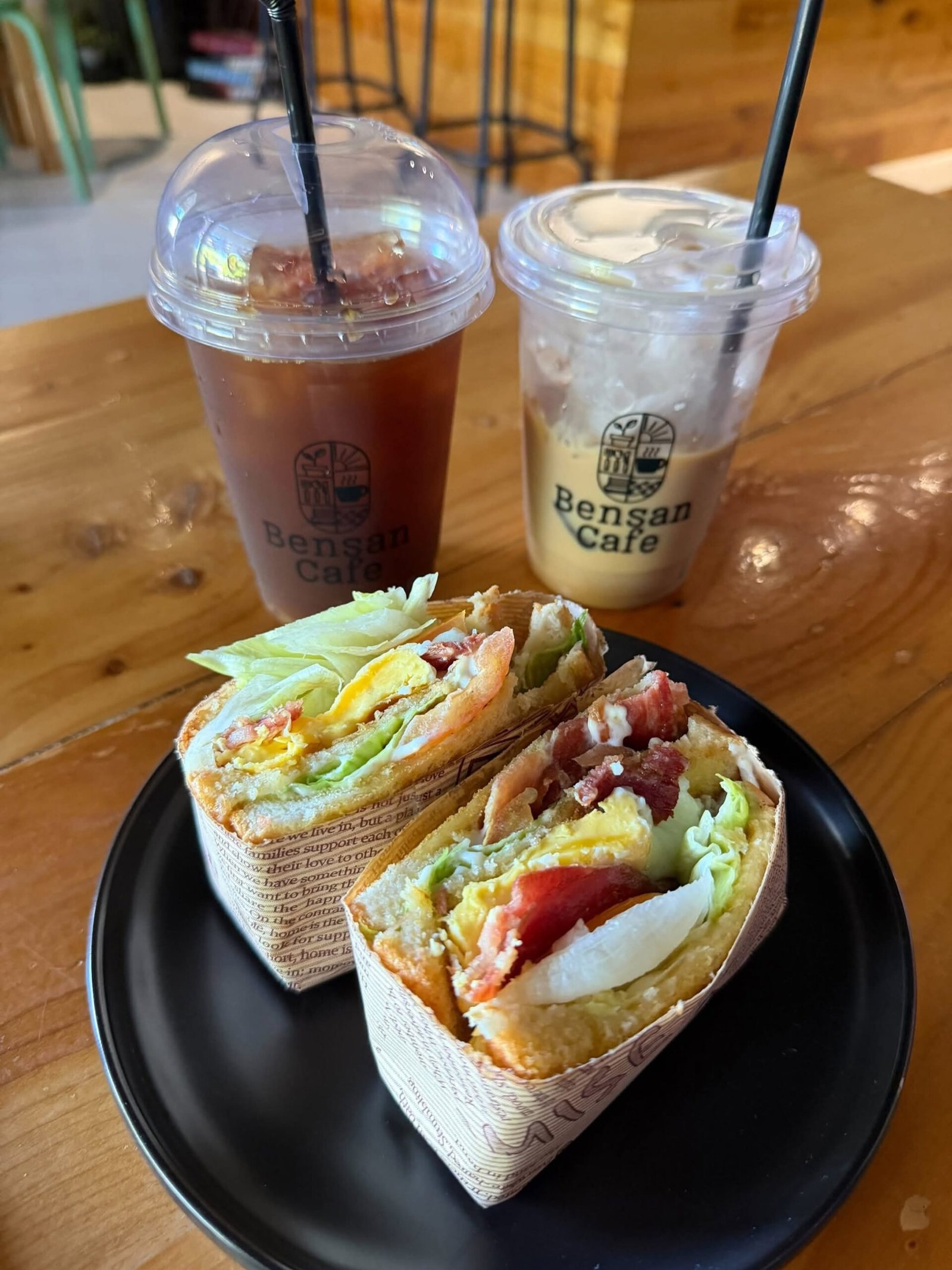 Sandwich and two iced drinks on a table at Bensan Cafe