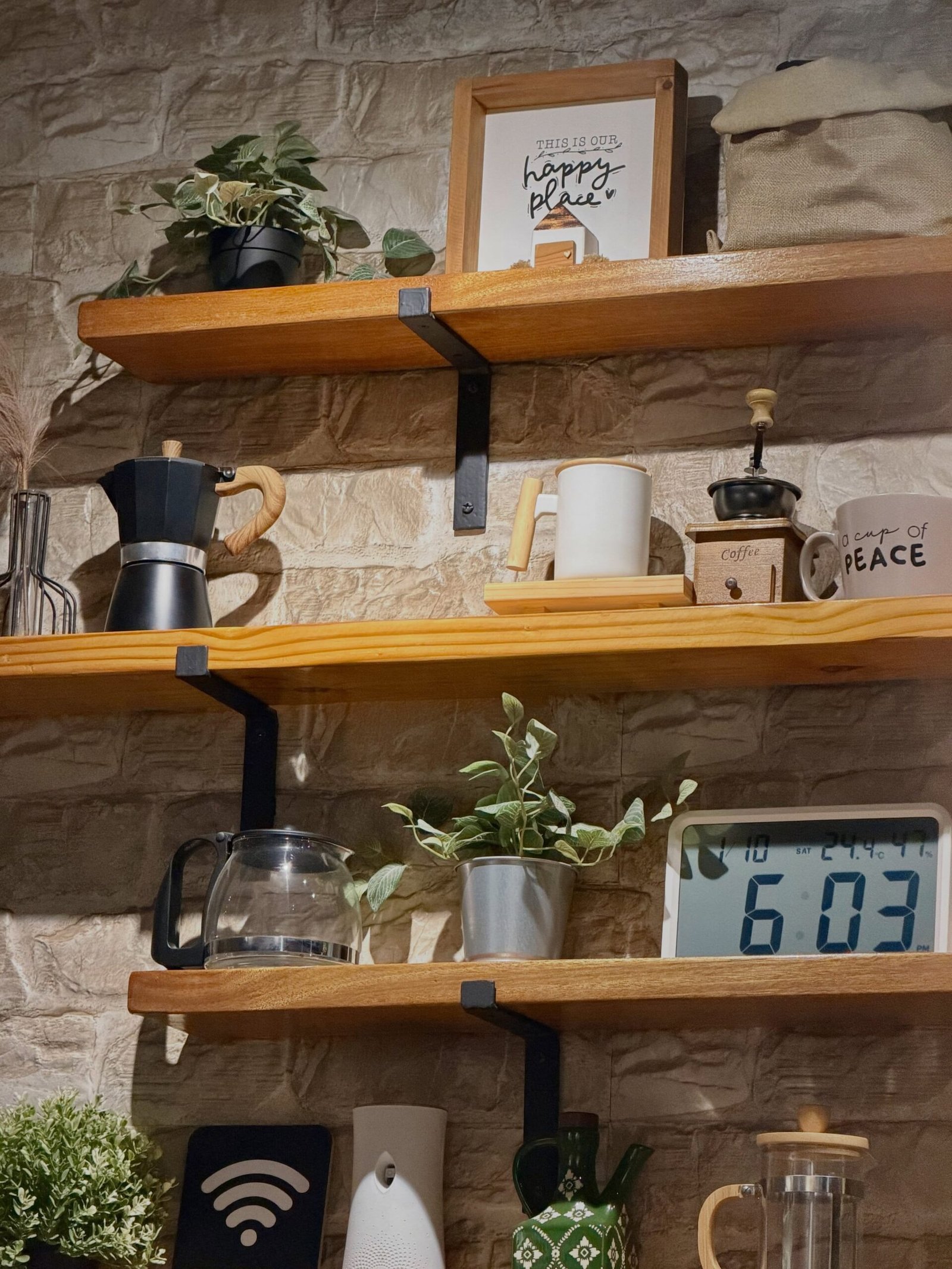Wooden shelves with coffee equipment and plants inside Bensan Cafe