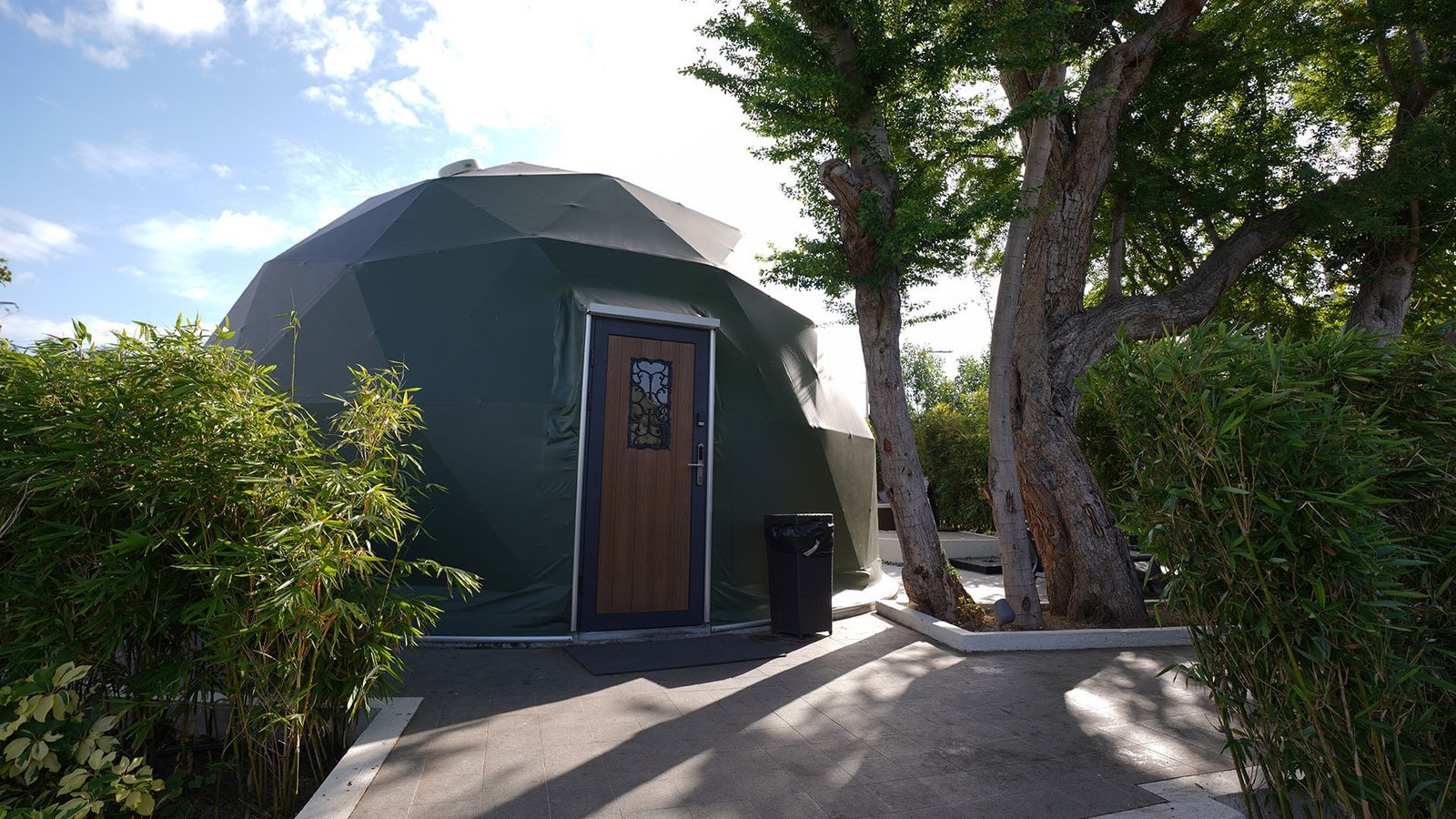 Dome suite entrance among trees at Cupola at CaSoBē