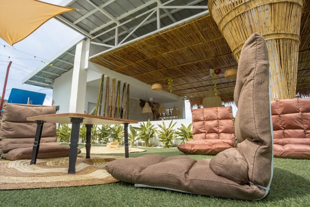 Outdoor lounge seating beside the dining area at Ionian Cabana