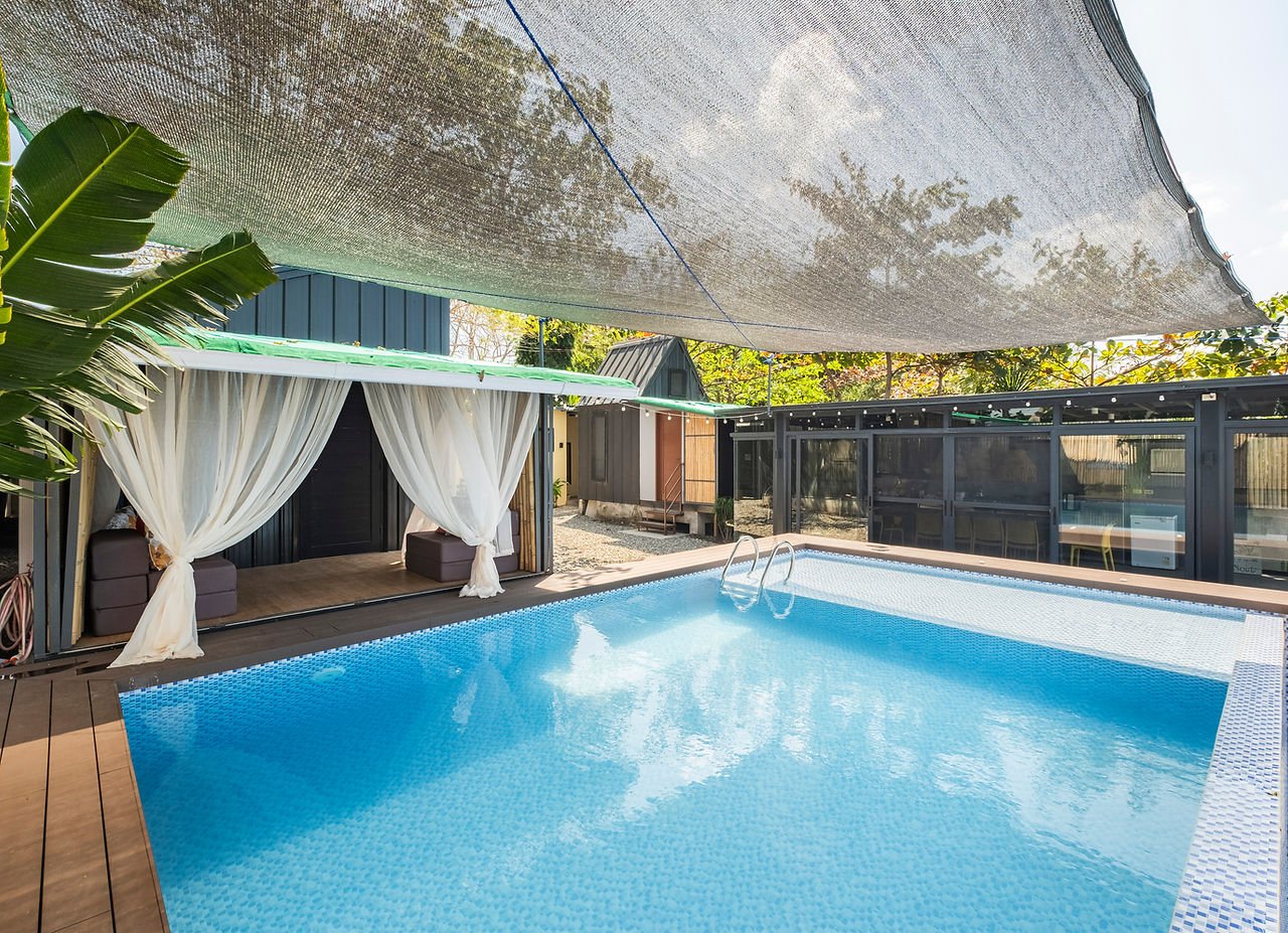 Swimming pool and cottages at Tirta Cottages Calatagan