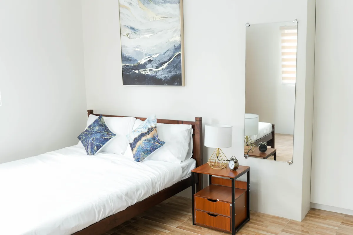 Bed and bedside table in the optional King en-suite bedroom at Valley Oville