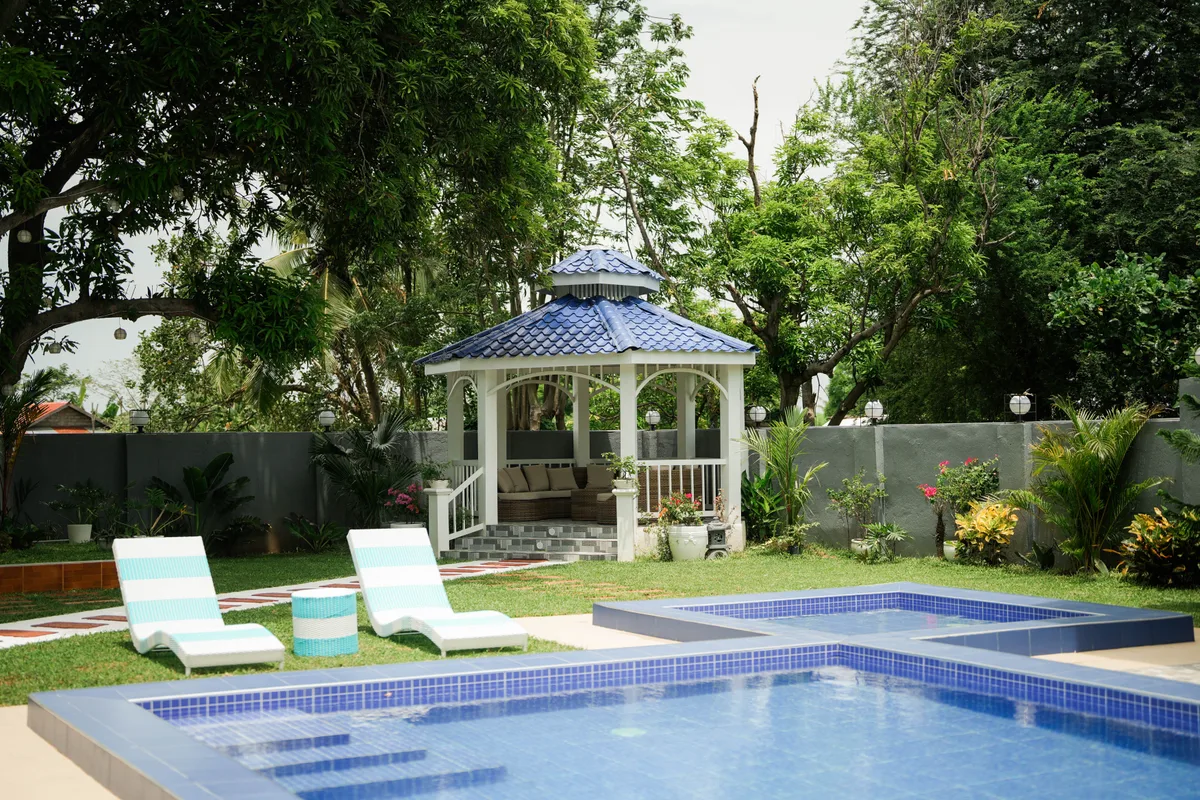 Valley Oville garden gazebo and poolside loungers